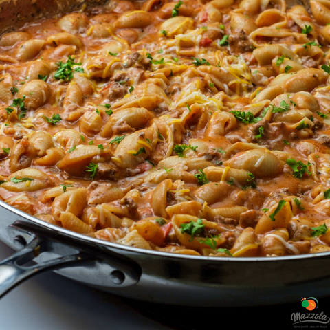 Mini pasta shells with meat and cream
